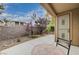 Cozy patio with mosaic table, secure gated entryway and low-maintenance desert landscaping at 10241 Premia Pl, Las Vegas, NV 89135