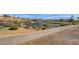 Picturesque community pond with golf course and residential area in the background at 10241 Premia Pl, Las Vegas, NV 89135