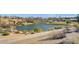 Scenic community pond surrounded by walking paths, golf course and houses at 10241 Premia Pl, Las Vegas, NV 89135