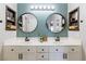 This contemporary bathroom boasts dual sinks, modern fixtures, and thoughtfully designed storage shelves on both sides at 10500 Pine Pointe Ave # 206, Las Vegas, NV 89144