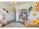 Bright Bedroom showcasing a well-organized closet with ample storage space, alongside a cozy crib at 10500 Pine Pointe Ave # 206, Las Vegas, NV 89144