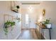 Inviting hallway featuring minimalist decor, a console table with decor, and modern light fixtures throughout at 10500 Pine Pointe Ave # 206, Las Vegas, NV 89144