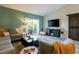 Comfortable living room with outdoor balcony, stylish decor and entertainment center at 10500 Pine Pointe Ave # 206, Las Vegas, NV 89144