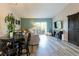 Stylish open-concept living area with patio access, barn door accent, and modern furniture at 10500 Pine Pointe Ave # 206, Las Vegas, NV 89144