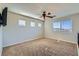 Bonus room with carpet, neutral walls, and many windows offering great natural light at 10654 Robin Hill Ave, Las Vegas, NV 89129
