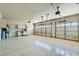 Spacious three car garage with storage cabinets, workspace, and ample lighting at 10654 Robin Hill Ave, Las Vegas, NV 89129
