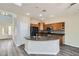 Well-lit kitchen features granite countertops, wood cabinetry, black appliances, and a modern backsplash at 10654 Robin Hill Ave, Las Vegas, NV 89129