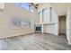 Spacious living room featuring high ceilings, modern floors, fireplace and natural light from large windows at 10654 Robin Hill Ave, Las Vegas, NV 89129