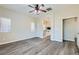 Spacious main bedroom boasts wood-look floors and an ensuite bathroom at 10654 Robin Hill Ave, Las Vegas, NV 89129