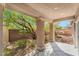 Backyard featuring a covered patio, desert landscaping, providing a perfect setting for outdoor relaxation at 10858 Morning Frost St, Las Vegas, NV 89179