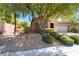 Charming home with a well-maintained front yard, mature trees, and a two-car garage in a desirable neighborhood at 10858 Morning Frost St, Las Vegas, NV 89179