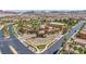 Aerial view of a well-maintained community center with lush landscaping, pool, and surrounding neighborhood at 1108 Via Della Curia, Henderson, NV 89011