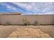 Desert-style backyard featuring rock landscaping, stone walkway, and mature plants at 1108 Via Della Curia, Henderson, NV 89011