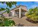 Private backyard with a covered patio, desert landscaping, and a block wall fence for added seclusion at 1108 Via Della Curia, Henderson, NV 89011
