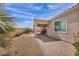 Cozy backyard showcasing a covered patio, low-maintenance landscaping, and a private, walled-in area at 1108 Via Della Curia, Henderson, NV 89011