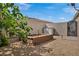 A backyard featuring desert landscaping, gravel, concrete walls, and a utility shed at 1108 Via Della Curia, Henderson, NV 89011