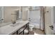 Well-lit bathroom featuring a single sink vanity with modern fixtures and a shower-tub combo at 1108 Via Della Curia, Henderson, NV 89011