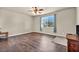 Bed room with wooden floors, a large window, and neutral walls, creating a serene retreat at 1108 Via Della Curia, Henderson, NV 89011