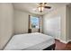 This bedroom has hardwood floors, a ceiling fan, and a large closet at 1108 Via Della Curia, Henderson, NV 89011