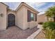 Close up on entrance of single story home with brick walkway and desert landscaping at 1108 Via Della Curia, Henderson, NV 89011