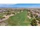 Scenic aerial shot of a community golf course, highlighting the well-manicured greens and strategically placed sand traps at 1108 Via Della Curia, Henderson, NV 89011