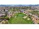Picturesque view of community golf course, showcasing lush green grass and sandy bunkers at 1108 Via Della Curia, Henderson, NV 89011