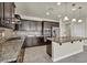 This kitchen features granite countertops, modern appliances, and custom cabinetry at 1108 Via Della Curia, Henderson, NV 89011