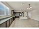 Spacious kitchen boasts stainless steel appliances, a center island, and ample counter space at 1108 Via Della Curia, Henderson, NV 89011