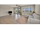 Cozy living room showcases tile flooring, patio access, and comfortable seating, creating a relaxing atmosphere at 1108 Via Della Curia, Henderson, NV 89011