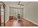 Home office space features hardwood floors, a desk, and an antique clock at 1108 Via Della Curia, Henderson, NV 89011