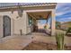 Covered patio with ceiling fan and desert landscaping and a brick walkway at 1108 Via Della Curia, Henderson, NV 89011