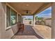 Covered patio area with ceiling fan and space for outdoor dining, offering a serene backyard view at 1108 Via Della Curia, Henderson, NV 89011