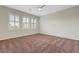 Bedroom featuring ceiling fan, shutters, neutral paint and carpet at 12122 High Country Ln, Las Vegas, NV 89138