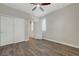 Bedroom with wood-look floors and a closet with mirrored sliding doors at 12122 High Country Ln, Las Vegas, NV 89138