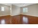 Large bedroom with wood floors and plantation shutters on the window at 12122 High Country Ln, Las Vegas, NV 89138