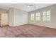 Bright bedroom with ceiling fan, shutters, closet, and neutral paint at 12122 High Country Ln, Las Vegas, NV 89138