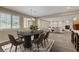 Elegant dining area showcasing abundant natural light and an open layout that flows into the cozy living space at 12122 High Country Ln, Las Vegas, NV 89138
