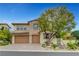 Beautiful home featuring a stone facade, manicured landscaping, and a three-car garage at 12122 High Country Ln, Las Vegas, NV 89138