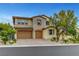 Charming two-story home with a stone and stucco exterior, three-car garage, and landscaped front yard at 12122 High Country Ln, Las Vegas, NV 89138