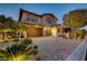 Charming two-story home with a well-maintained yard, paved driveway, and a spacious two-car garage at 12122 High Country Ln, Las Vegas, NV 89138