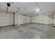 Spacious three-car garage featuring ample storage space and automatic door openers at 12122 High Country Ln, Las Vegas, NV 89138