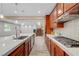 Modern kitchen highlighted by stainless appliances, a gas cooktop, island sink, and open floor plan at 12122 High Country Ln, Las Vegas, NV 89138