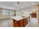 Expansive kitchen offering an island with seating, stainless steel appliances, and an open-concept design at 12122 High Country Ln, Las Vegas, NV 89138