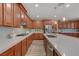 Well-appointed kitchen showcasing stainless appliances, generous counter space, and wooden cabinetry at 12122 High Country Ln, Las Vegas, NV 89138