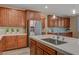 Kitchen offering stainless steel appliances, spacious countertops, and attractive wooden cabinets at 12122 High Country Ln, Las Vegas, NV 89138