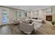 Open-concept living area with fireplace, neutral color palette, and direct access to outdoor spaces for seamless indoor-outdoor living at 12122 High Country Ln, Las Vegas, NV 89138