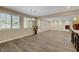 Sun-drenched living space boasting wood floors, large windows, fireplace, and views of the open layout at 12122 High Country Ln, Las Vegas, NV 89138