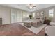 Spacious main bedroom suite boasting a private balcony, plush carpeting, and plantation shutters at 12122 High Country Ln, Las Vegas, NV 89138