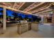 Well-equipped outdoor kitchen with a built-in grill, countertop, and storage, perfect for outdoor cooking and dining at 12122 High Country Ln, Las Vegas, NV 89138