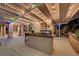 Outdoor kitchen with a built-in grill, bar seating, and a covered patio area, perfect for entertaining at 12122 High Country Ln, Las Vegas, NV 89138